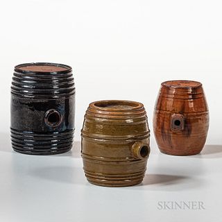Three Glazed Redware Keg-form Canteens, New England, early 19th century, one with manganese splotches, one with yellow/olive green glaz