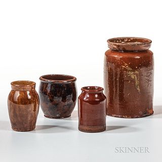 Four Glazed Redware Jars, northeastern United States, 19th century, a cylindrical jar with yellow splotches attributed to Nathaniel Sey