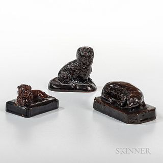 Three Animal Figural Pottery Pieces, 19th century, a sheep paperweight, a smaller lion redware paperweight, and a seated poodle figure,