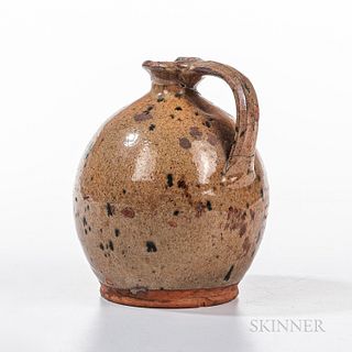 Small Glazed Redware Jug, America, 19th century, bulbous body with light green glaze with dark green spots, flaring neck, applied strap