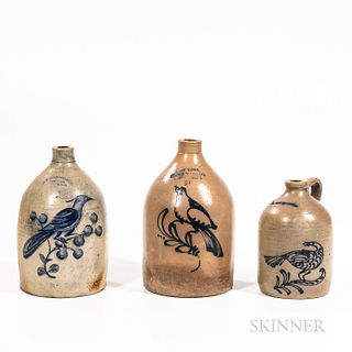 Three Cobalt-decorated Stoneware Jugs, New England, mid to late 19th century, all with cylindrical bodies, rounded shoulders, and attac