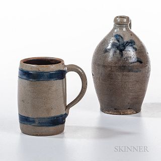 Two Cobalt-decorated Stoneware Vessels, New York, mid-19th century, a mug with blue band decoration and applied strap handle, and an ov
