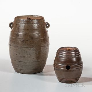 Two Stoneware Whiskey Casks, America, mid-19th century, the larger with molded bands and hanging lugs, possibly from Akron, Ohio; the s
