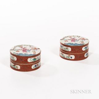 Pair of Chinese Export Porcelain Cylindrical Boxes, early 19th century, the tops with figural scenes, the sides red with floral reserve