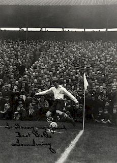 Tom Finney, English Footballer, taking a corner kick with a crowded stand behind, inscribed 'To Harr