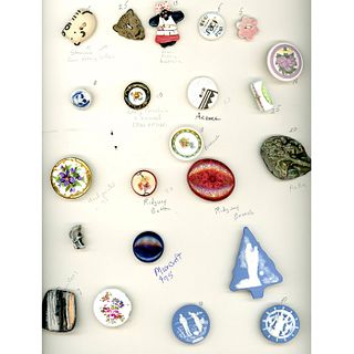 A CARD OF ASSORTED CERAMIC BUTTONS