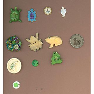 A PARTIAL CARD OF ASSORTED MATERIAL FROG BUTTONS