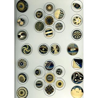 A WHOLE CARD OF 20TH C. CREAM/BLACK CELLULOID BUTTONS