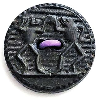 A DIVISION ONE BACKMARKED GOODYEAR RUBBER FROGS BUTTON