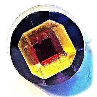 A SCARCE DIVISION ONE COLORED GLASS TINGUE BUTTON
