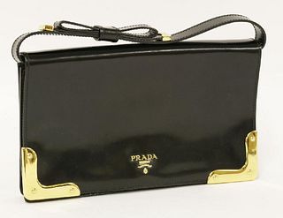 A Prada black patent leather clutch handbag