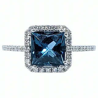 Fashionable London Blue Topaz & Diamond Halo Ring