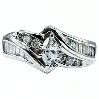 Marquise, Round & Baguette Cut Diamond Engagement Ring