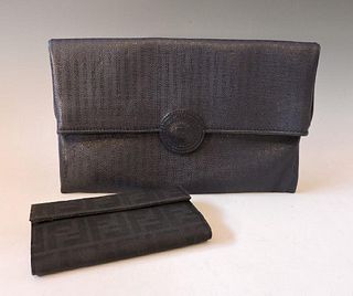 A Fendi navy embossed striped leather fold-over clutch