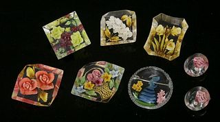 A collection of six reverse-painted Lucite brooches