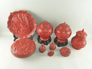 Collection of modern red cinnabar lacquered items to include pair of vases and covers, plate, bowl a