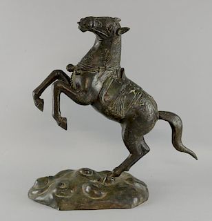 Chinese bronze horse rearing up on it's hind legs, on naturalistic base, 42cm high,