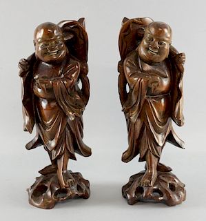 Pair of Chinese root carvings of men with hats and fly swats, on naturalistic bases, 32cm high,