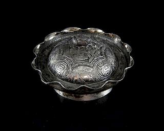 Chinese silver dish of shaped circular form engraved with figures at various pastimes, the cover wit