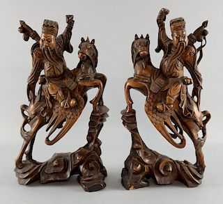 Pair of Chinese carved wood figures on horseback, 36cm high,