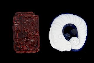 Chinese Peking red glass plaque with carved decoration, 5.5cm long, and a blue and white glass sea c