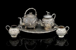 Late 19th/ early 20th century Chinese silver miniature four piece tea service, comprising tray, teap