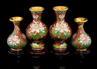 Two pairs of modern Chinese cloisonne vases with brick red grounds and decorated with flowers, on ha