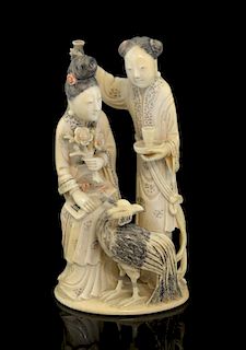 19th century Chinese carved ivory figural group of two ladies holding objects, one seated the other