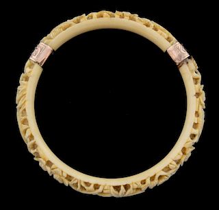 Chinese ivory bangle carved with birds, flowers and bamboo, yellow metal mounts, 10cm diameter,