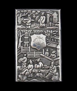 Late 19th/ early 20th century Chinese silver card case with a slip cover, embossed scenes of figures