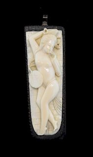 Early 20th century Chinese carved ivory figure of a reclining nude lady, on hardwood base, 14cm long