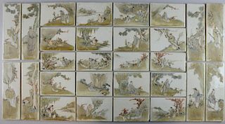 Set of twenty-eight late 19th/ early 20th century Chinese porcelain tiles depicting figures at vario
