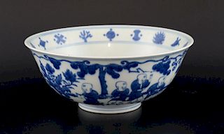 Chinese blue and white bowl decorated with boys playing in a garden, Ming marks but later, 22cm diam