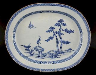 18th century Chinese blue and white dish decorated with two cranes and a tree, 39cm x 32cm,