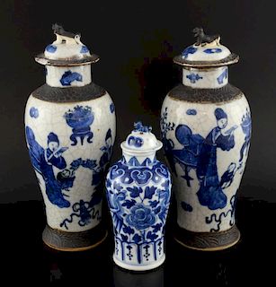 Pair of Chinese crackle glazed blue and white vases decorated with figures and auspicious objects an