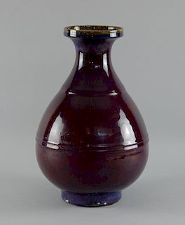 Chinese sang de boeuf vase with plain banded decoration on round foot, 34cm high,
