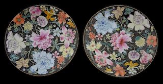 Pair of Chinese famille noir porcelain saucers with floral decoration, iron red marks and four bats