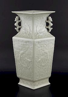 20th century Chinese celadon Longquan style vase of lozenge section with moulded dragon and floral d
