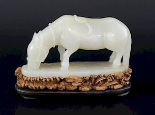 Chinese white jade figure of a horse on carved stand 14cm wide