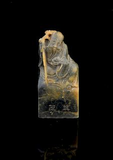 Chinese soapstone seal carved as Shoulao, two characters to the front and calligraphy verso, 6.2cm h