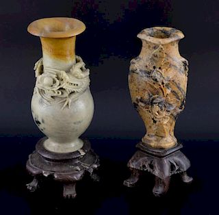 Two Chinese soapstone vases, the first of baluster form and carved with a dragon chasing the flaming