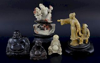 Five Chinese soapstone figures, comprising three figures of Buddha, a figure seated on the back of a
