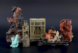Five Chinese soapstone carvings comprising a bearded figure in a booth, a seal form carving of a bea