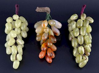 Three bunches of modern Chinese green and coloured hardstone grapes, largest 22cm long,