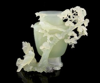 Chinese green jadeite vase with carved decoration of birds amongst foliage, 15cm high, (lacking cove