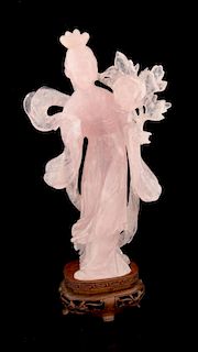 Chinese carved rose quartz figure of a lady in a flowing robe holding a flower, on hardwood base, 22