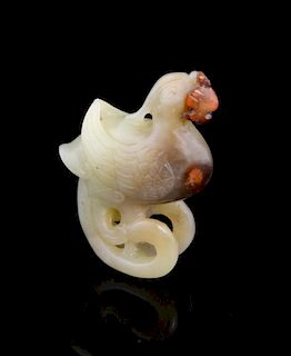 Chinese pale green/yellow jade carving of a  Phoenix, with iron inclusions, the tail curving under t