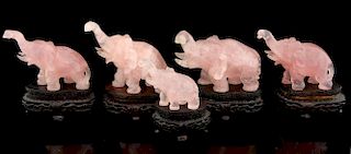 Set of five Chinese carved rose quartz elephants, on hardwood bases, tallest 9cm high,