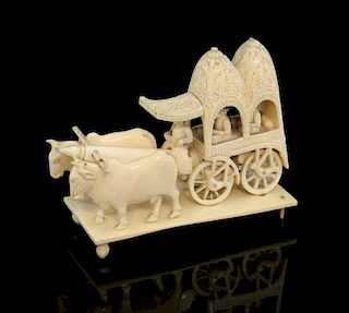 Indian carved ivory twin domed palanquin with driver and two oxen pulling, on rectangular ivory base