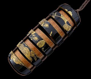 Japanese black lacquered and gilt floral and foliage decorated six section Inro, 8cm high,
